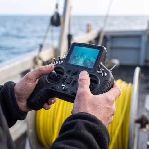 ROV handheld controller, macro — Course imagery, marine robotics.