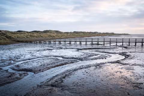 Tidal flat panorama, low tide — Landing page imagery, coastal landscape hero.